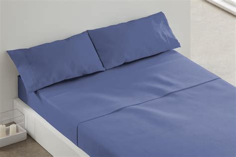 Esquema de las capas de una cama: colchón, protector, sábana bajera, sábana encimera