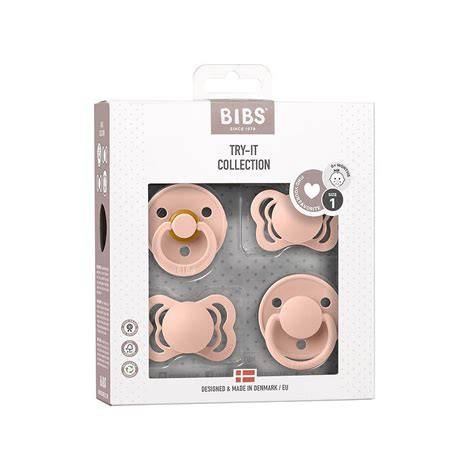 Foto de una caja surtida de chupetes BIBS con diferentes modelos y colores