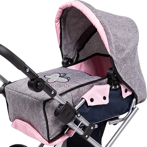 Detalle de un manillar ajustable en una silla de paseo para muñecas.