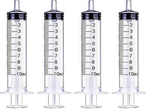 Muestra de jeringas orales dosificadas y pequeños vasos de medicación