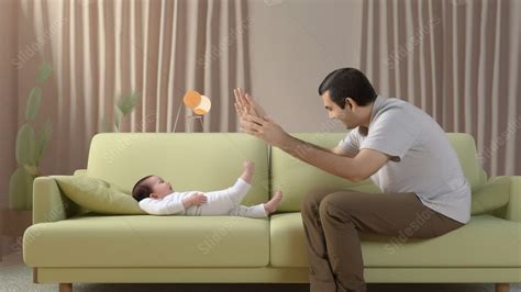 Padre acostado en el suelo interactuando con su bebé durante el tummy time