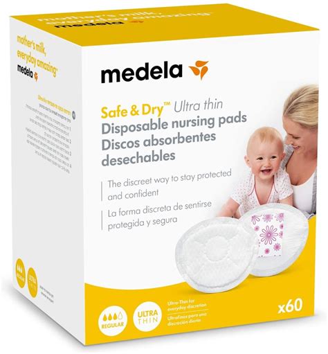 Foto de primer plano de los discos absorbentes lavables Medela colocados discretamente en un sujetador de lactancia