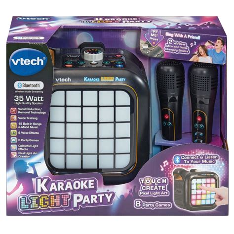 Niño o niña cantando con el VTech Karaoke Light Party Duo Golden Edition, rodeado de luces.