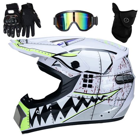 Foto de niño con casco de motocross y equipamiento