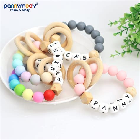 Sonajero de bebé personalizado con perlas y nombre