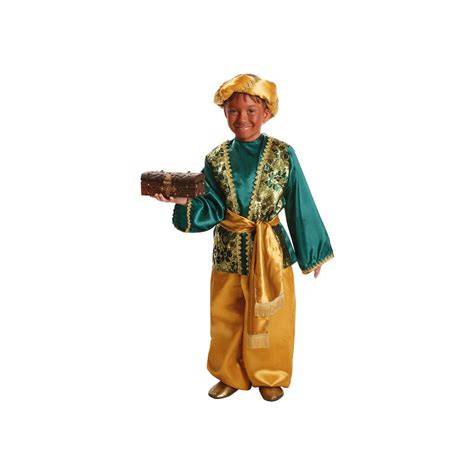 Ilustración de un niño vestido de paje real con capa y turbante saludando en una carroza