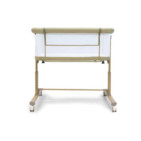 Minicuna Asalvo Nidus beige con un bebé dentro
