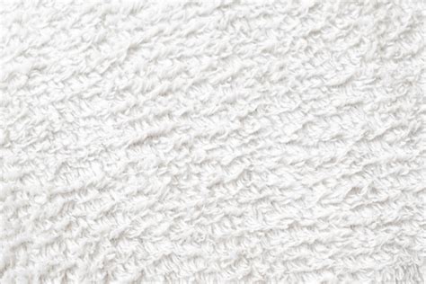 Detalle de la textura suave de una toalla de algodón orgánico para bebé