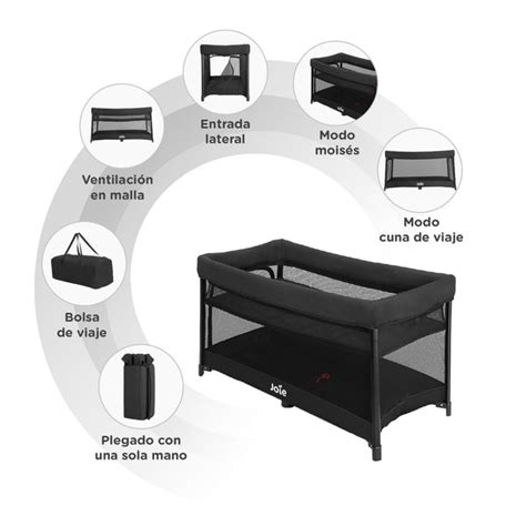 Cuna de viaje Joie MaieFair adaptada junto a una cama de adulto