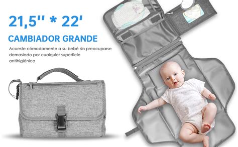 Interior del bolso cambiador Elodie mostrando compartimentos organizados para pañales, toallitas y un bolsillo térmico para biberón.