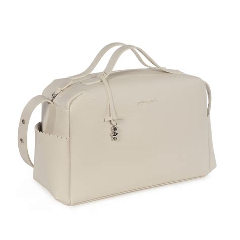 bolso organizador Pasito a Pasito Icon Cream con detalles de polipiel y bolsillos interiores