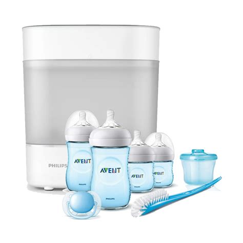 Bebé feliz junto a biberones limpios y un esterilizador Philips Avent