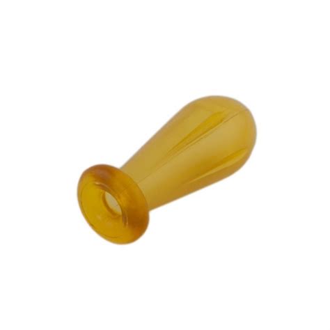 Primer plano de una tetina de laboratorio de látex, mostrando su forma redondeada y color.