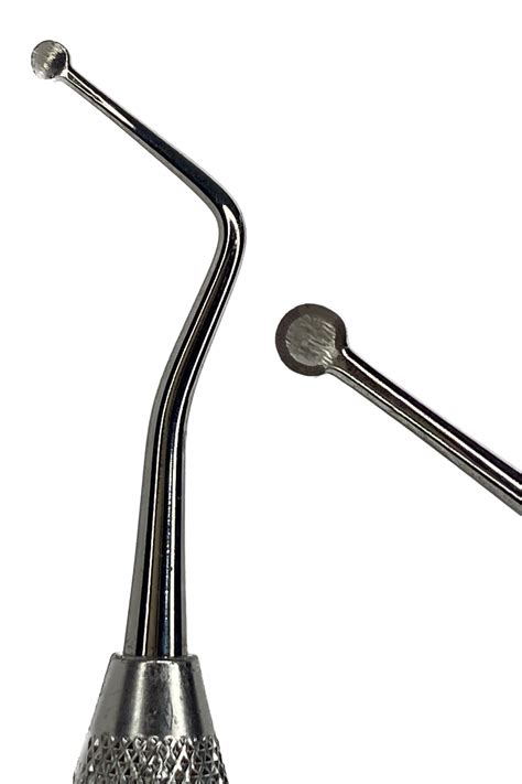 Foto de una legra dental o cucharilla de legrado en detalle