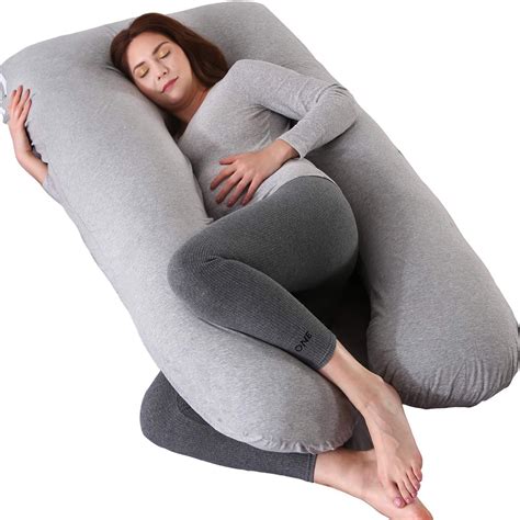 Esquema de las posturas recomendadas para embarazadas usando una almohada de cuerpo completo para alinear la columna y aliviar la zona lumbar