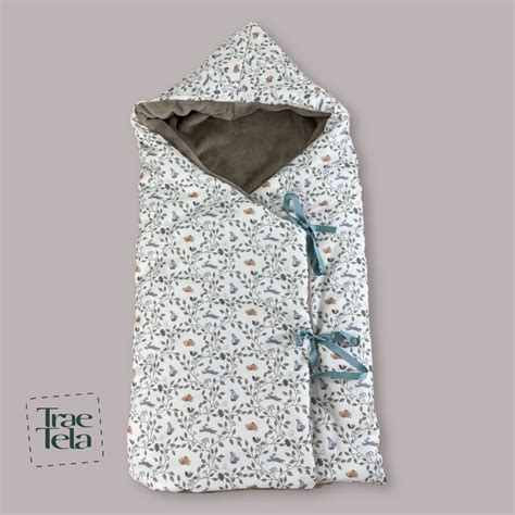 Diseño de un capazo de bebé amplio y confortable con interior de algodón y certificado Oeko-Tex®.