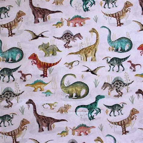 Funda nórdica para minicuna con estampado de dinosaurios y detalles de las telas