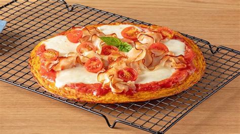 Pizza con base de calabaza y queso fundido