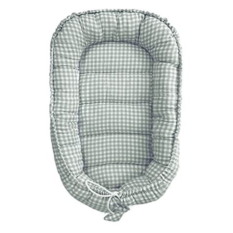 Esquema visual mostrando los diferentes usos del nido de colecho: colecho, reductor de cuna, cuna de viaje, cambiador.